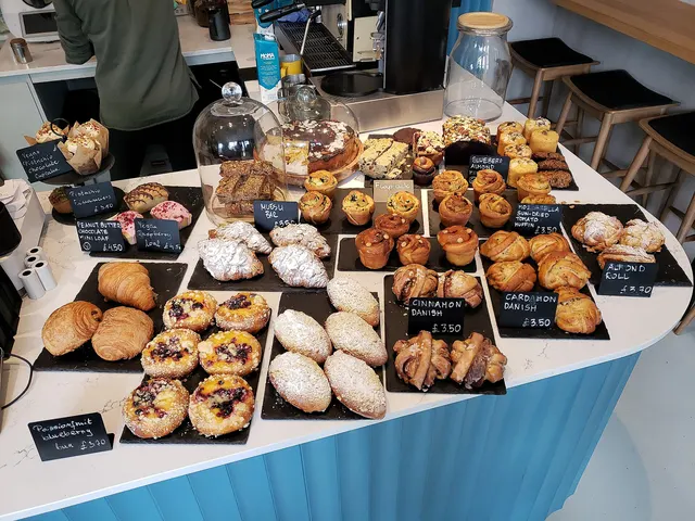 Pastries, croissants and muffins on the counter of a bakery café