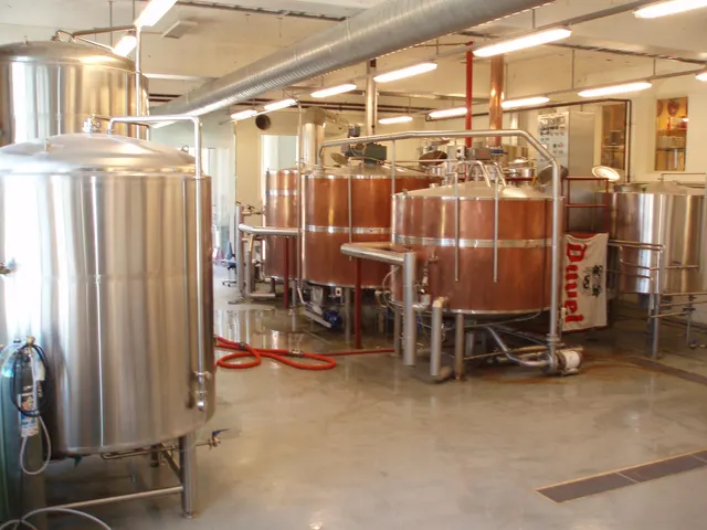 Copper and steel brewing kettles in a small brewery