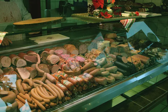 Cold cuts and sausages in a butcher shop display case