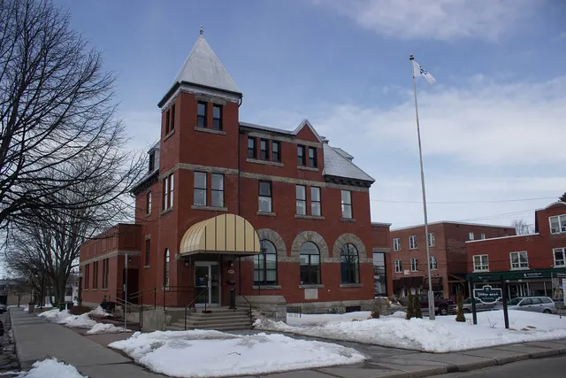 Acton Vale municipal library in a turreted brick building in early spring