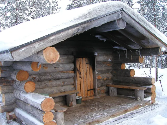 Traditional log sauna under the snow