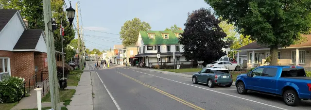 Montebello's main street with houses and parked cars
