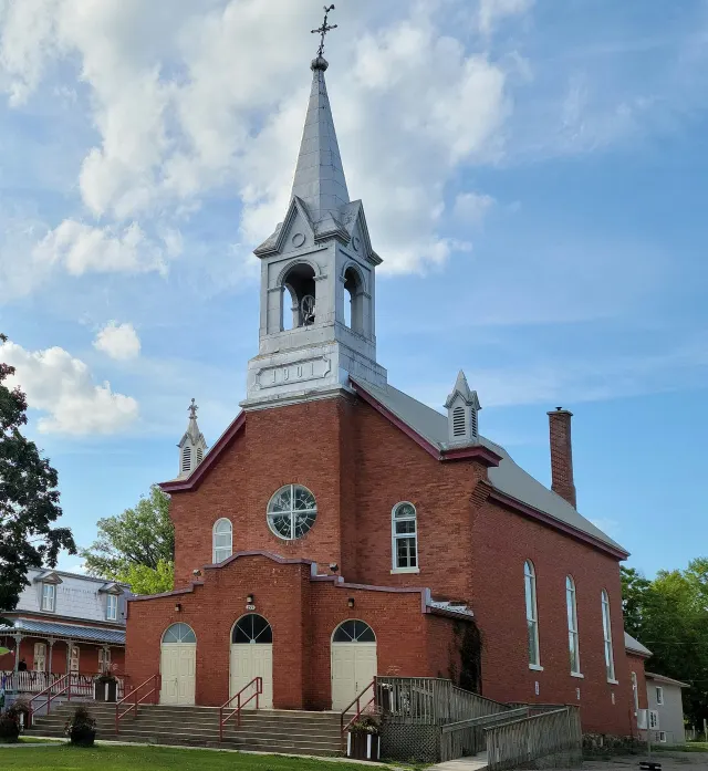 Plaisance's red-brick church with its silver steeple