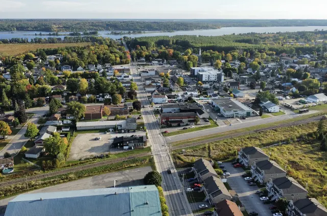 Aerial view of Thurso, its streets and the Ottawa River on the horizon